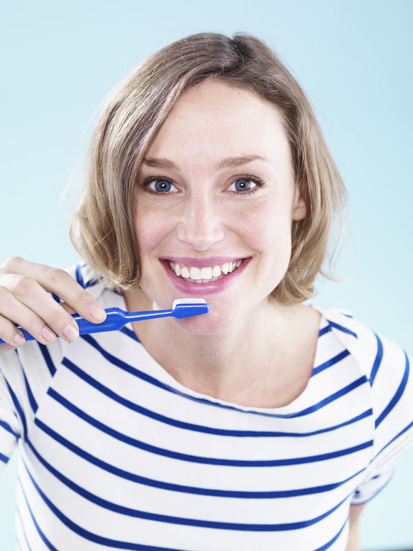 Woman Brushing for The Tongue Test 